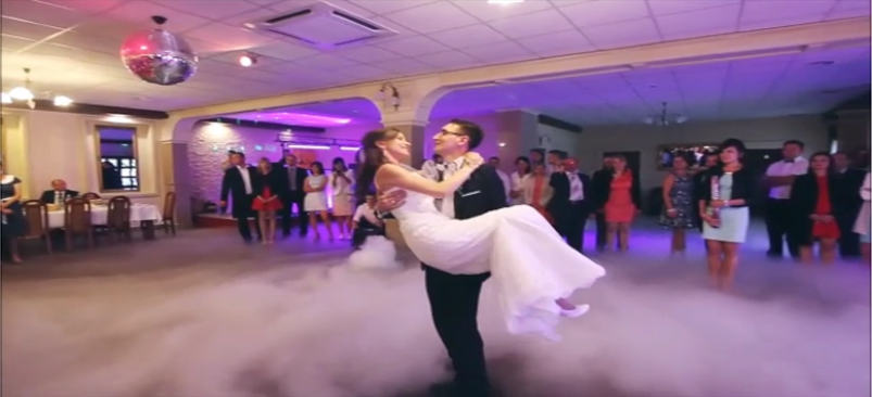 Wedding couple performing a dance lift